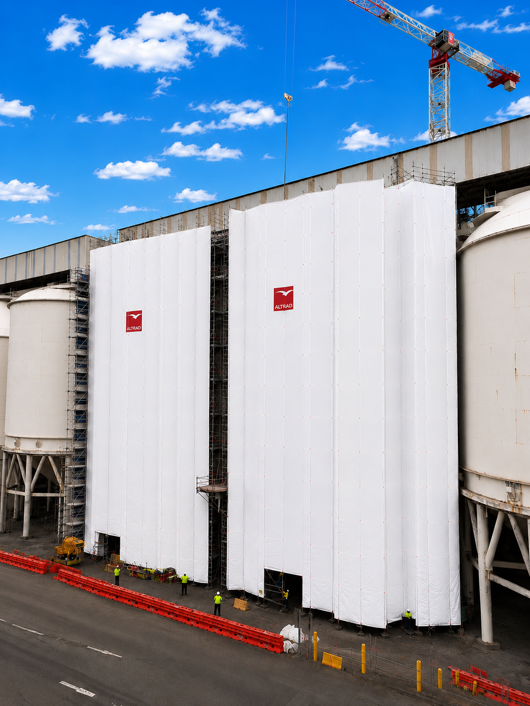 White BlastGuard containment panels installed on an industrial scaffold